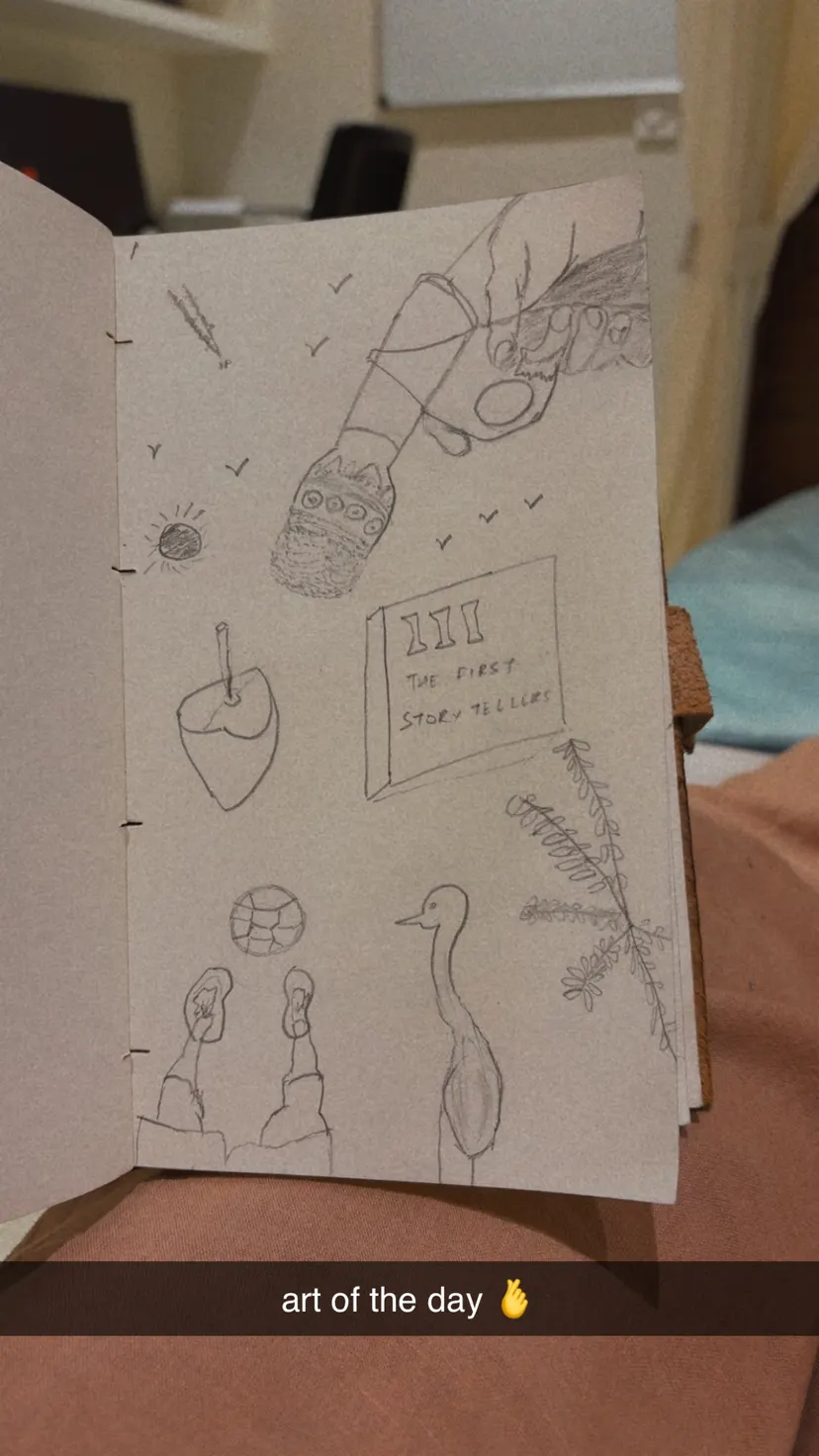 Pencil drawing of feet, a bird and a coconut on a story-tellers page