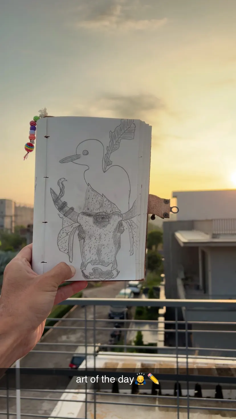 Pencil drawing of a cow with a bird on its head
